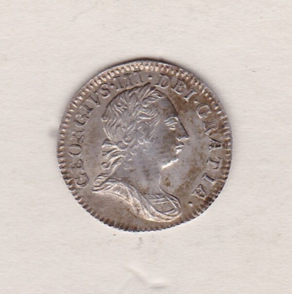 1762 Silver Maundy Threepence coin featuring King George III on the obverse. A central denomination below crown with date divided on the reverse.