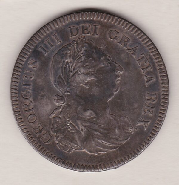 1804 Silver Dollar Five Shillings Coin featuring King George III on the Obverse. The reverse has a seated image of Britannia facing left.