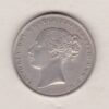 1858 silver shilling coin featuring Queen Victoria young head on the Obverse. The Reverse has a crown, laurel and oak leaves within an open wreath.