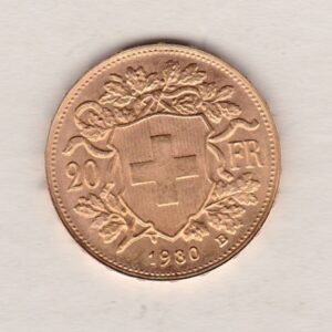 1930 B Switzerland Gold Twenty Francs coin features a female figure on the obverse. The Swiss shield surrounded by oak leaves on the Reverse.