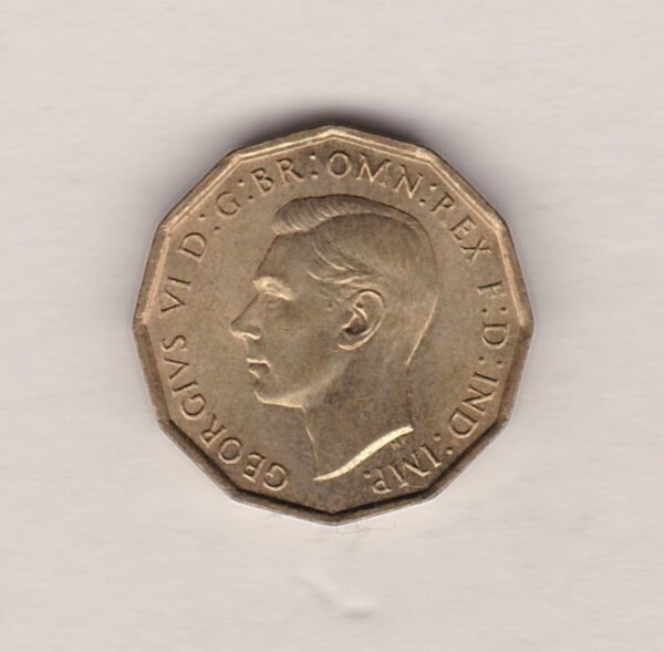 1948 Brass Threepence Coin featuring the portrait of King George VI on the Obverse. The thrift plant with denomination and date is on the Reverse.