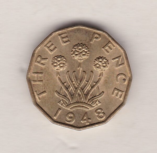 1948 Brass Threepence Coin featuring the portrait of King George VI on the Obverse. The thrift plant with denomination and date is on the Reverse.