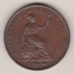 1846 copper penny coin featuring the young head portrait of Queen Victoria on the Obverse. The coin depicts Britannia seated to the right on the Reverse.