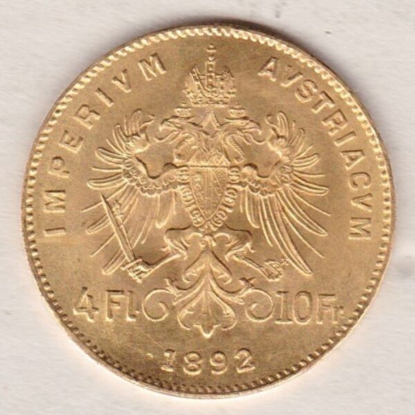 1892 Austria Gold 4 florin 10 franc featuring the portrait of Emperor Franz Joseph I on the Obverse. The double-headed imperial eagle is on the Reverse.