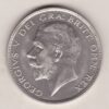 1928 Silver Halfcrown coin featuring the King George V on the Obverse. The Quartered shield of arms flanked by crowned royal cyphers complete the Reverse.