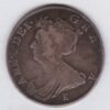 1707 E Silver Halfcrown coin with Queen Anne on the Obverse. Crowned cruciform shields with central Garter stars on the Reverse.