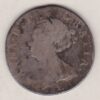 1707 E silver shilling coin featuring the draped bust of Queen Anne on the Obverse. The crowned cruciform shield on the Reverse.