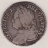 1743 silver shilling coin featuring a laureate and draped bust of George II. The crowned cruciform shields with roses and plumes on the Reverse.