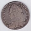 1746 Lima Silver Halfcrown coin with King George II on the Obverse. Crowned cruciform shields with central Garter stars on the Reverse.