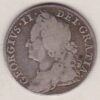 1747 silver shilling coin featuring a laureate and draped bust of George II. The crowned cruciform shields with roses and plumes on the Reverse.