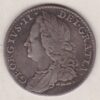 1758 silver sixpence coin featuring a laureate bust of George II. There are four crowned shields arranged in a cross on the Reverse.