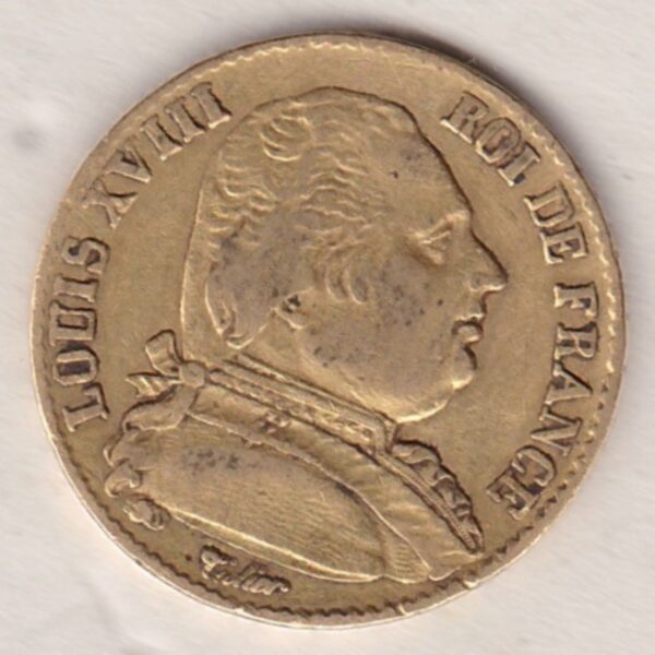 1814 A France Gold Twenty Francs coin featuring the portrait of Louis XVIII on the Obverse. The crowned shield of France on the Reverse.