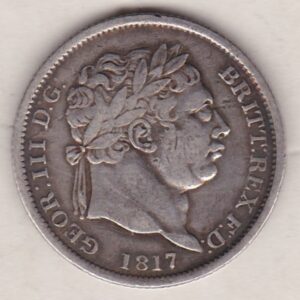 1817 Silver Shilling Coin featuring a laureate bust or 'bull head' of King George III on the Obverse. The crowned shield of royal arms on the Reverse.