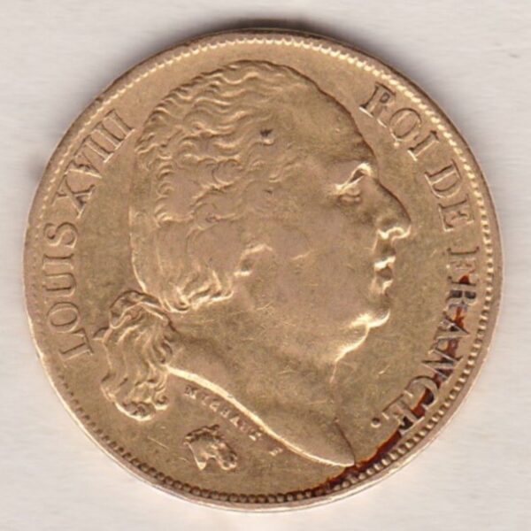 1824 A France Gold Twenty Francs coin featuring the portrait of Louis XVIII on the Obverse. The crowned shield of France on the Reverse.