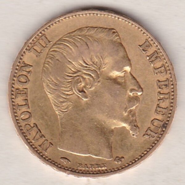 1857 A France Gold Twenty Francs coin featuring Napoleon III on the Obverse. The reverse has the denomination above the date within a wreath.