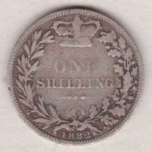 1882 silver shilling coin featuring Queen Victoria young head on the Obverse. The Reverse has a crown, laurel and oak leaves within an open wreath.