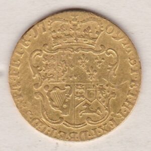 1769 Gold Half Guinea Coin featuring the laureate head portrait of King George III on the obverse. The reverse ornate crowned quartered shield of arms.