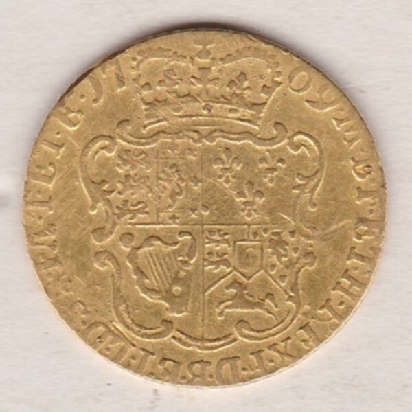 1769 Gold Half Guinea Coin featuring the laureate head portrait of King George III on the obverse. The reverse ornate crowned quartered shield of arms.