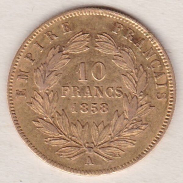 1858 A France Gold Ten Francs coin featuring Napoleon III on the Obverse. A wreath of laurels, date and mint mark on the Reverse.