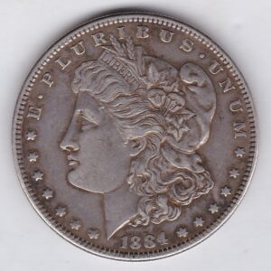 1884 Silver USA Morgan Dollar coin featuring lady liberty on the obverse. The eagle holding arrows and an olive branch on the reverse.