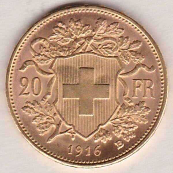 1916 B Switzerland Gold Twenty Francs coin features a female figure on the obverse. The Swiss shield surrounded by oak leaves on the Reverse.