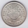 1937 Silver Crown Coin featuring the uncrowned portrait of King George VI on the obverse. A crowned quartered shield of arms on the reverse.