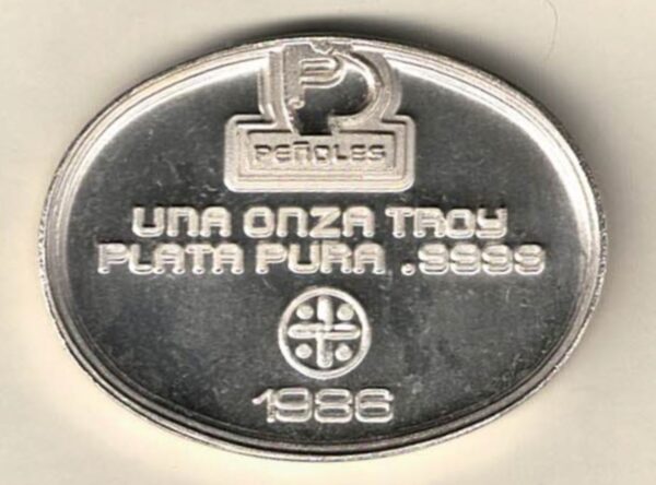 1986 Mexico silver Onza one ounce (Penoles) oval round. This oval round contains one ounce of .9999 fine silver featuring (Penoles) Logo.