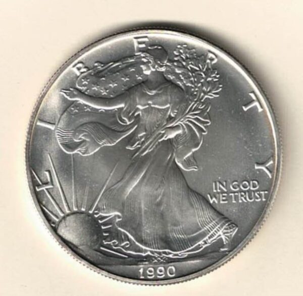 1990 Silver USA One Ounce Eagle. The liberty is on the obverse, The eagle is on the reverse. The coin contains one ounce of 999 fine silver.