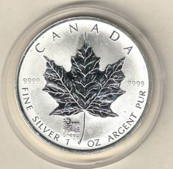 2003 Silver Canada One Ounce Maple Privy mark. Elizabeth II is on the obverse, The Maple is on the reverse. The coin contains one ounce of 9999 fine silver