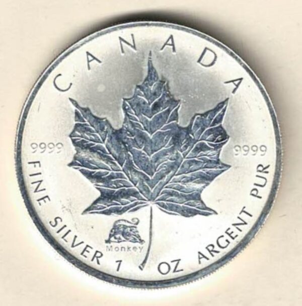 2004 Silver Canada One Ounce Maple Privy mark. Elizabeth II is on the obverse, The Maple is on the reverse. The coin contains one ounce of 9999 fine silver.