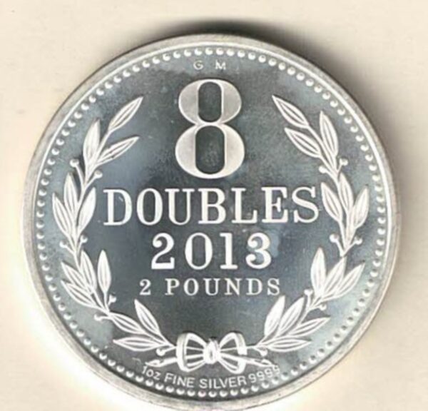 2013 Silver Guernsey One Ounce 8 Doubles. The coat of arms is on the obverse, 8 Doubles is on the reverse. The coin contains one ounce of 9999 fine silver