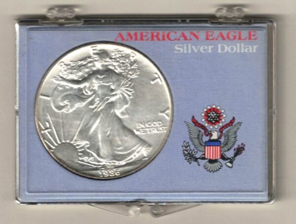 1986 Silver USA One Ounce Eagle cased . The liberty is on the obverse, The eagle is on the reverse. The coin contains one ounce of 999 fine silver.