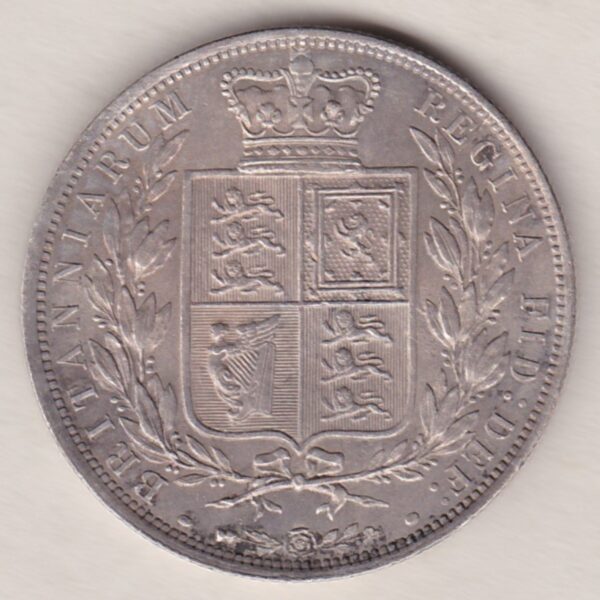 1883 Silver Halfcrown coin with young head Queen Victoria on the Obverse. Crowned square shield with laurel branches on the Reverse.