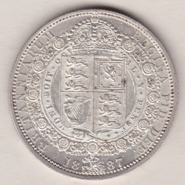 1887 Silver Halfcrown coin featuring the Jubilee head of Queen Victoria on the Obverse. The shield of royal arms completes the Reverse design.