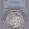 1887 Silver USA Morgan Dollar coin featuring lady liberty on the obverse. The eagle holding arrows and an olive branch on the reverse.