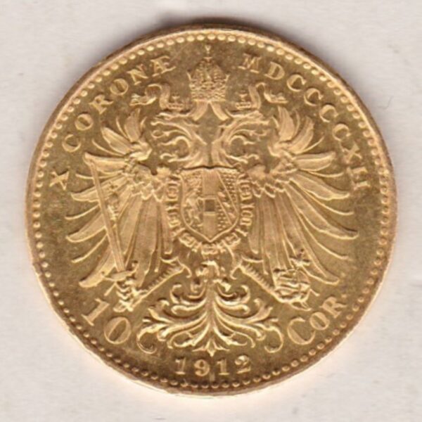 1912 Austria 10 Corona featuring the portrait of Emperor Franz Joseph I on the Obverse. The double-headed imperial eagle is on the Reverse.