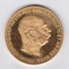 1915 Austria 100 Corona featuring the portrait of Emperor Franz Joseph I on the Obverse. The double-headed imperial eagle is on the Reverse.