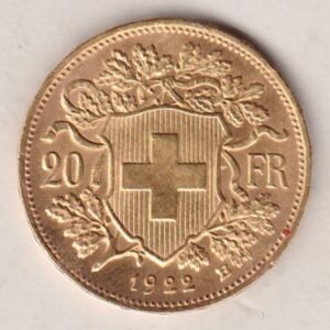 1922 B Switzerland Gold Twenty Francs coin features a female figure on the obverse. The Swiss shield surrounded by oak leaves on the Reverse.