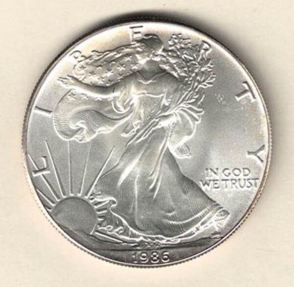 1986 Silver USA One Ounce Eagle. The liberty is on the obverse, The eagle is on the reverse. The coin contains one ounce of 999 fine silver.