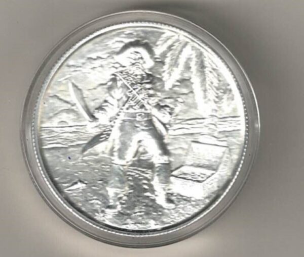 Silver Two Ounce No Prey No Pay Pirate. This two ounce fine silver round has a pirate with a sword on one side & skull on the other side.