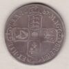 1687 Silver Halfcrown coin. The obverse features King James II. The reverse features the crowned cruciform shields around central Garter star.