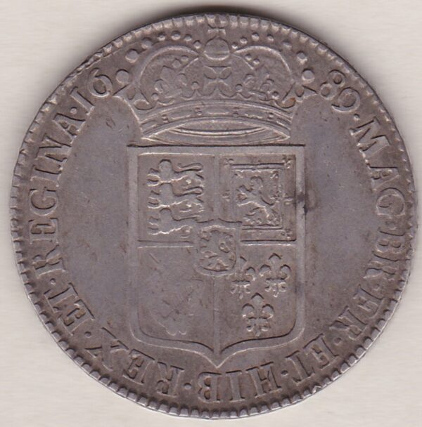 1689 Silver Halfcrown coin. The obverse features King William and Queen Mary. The reverse features the first quartered shield of arms.