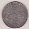 1707 Silver Halfcrown coin with Queen Anne on the Obverse. Crowned cruciform shields with central Garter stars on the Reverse.