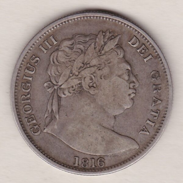 1816 Silver Halfcrown coin with King George III on the Obverse. The reverse features a a crowned Garter and ornate Royal shield of arms.