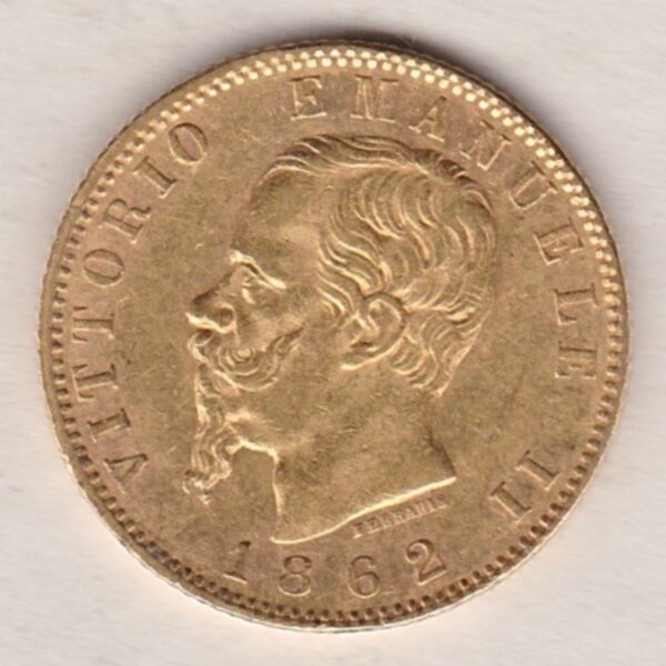 1862 T BN Italy Gold Twenty Lire coin featuring King Vittorio Emanuele II on the obverse. The crowned Savoy shield of arms on the reverse.