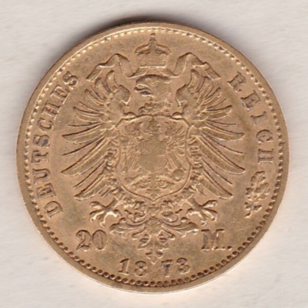 1873 A Germany Gold Twenty Mark coin featuring the bust of Wilhelm I on the obverse. The crowned imperial eagle on the reverse.