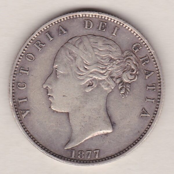 1877 Silver Halfcrown coin with young head Queen Victoria on the Obverse. Crowned square shield with laurel branches on the Reverse.