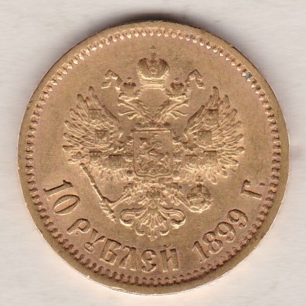 1899 Gold Russia Ten Roubles coin. The obverse features Emperor Nicholas II. The reverse features the two-headed eagle with date and denomination.