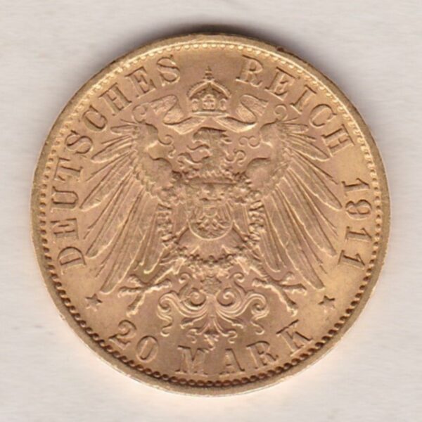 1911 A Germany Gold Twenty Mark coin featuring the bust of Wilhelm II on the obverse. The crowned imperial eagle on the reverse.