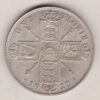 1920 Silver Florin coin. The portrait of King George V on the Obverse. The crowned cruciform shields around central Garter star on the reverse.